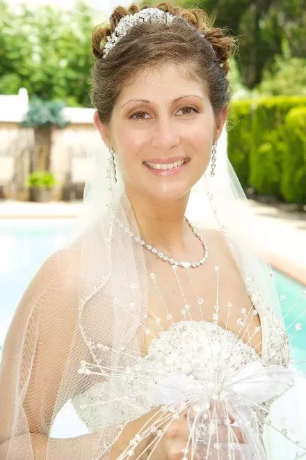 Veil or Not to Veil? 4 Bride smiling in her veil